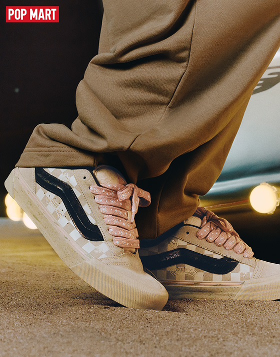 Close-up of the adults’ Vans x Space Molly Knu Skool with pants jeans on the set of a space-themed shoot.