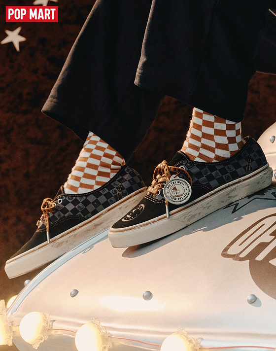 Close-up of the adults’ Vans x Space Molly Authentic with brown checkerboard socks and black jeans on the set of a space-themed shoot.