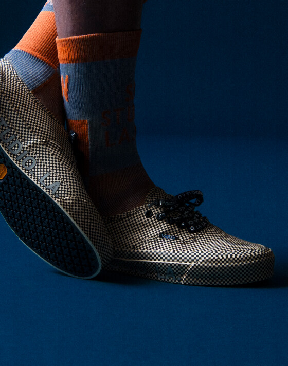 OTW by Vans X SRLA authentic shoes with a navy blue background.