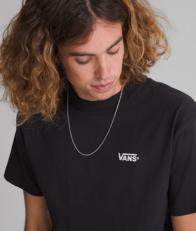 Man wearing New Left Chest T-Shirt in Black / White in a photography studio.