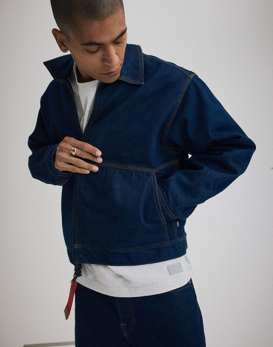 Medium shot of a man wearing a Premium Denim Station Jacket.