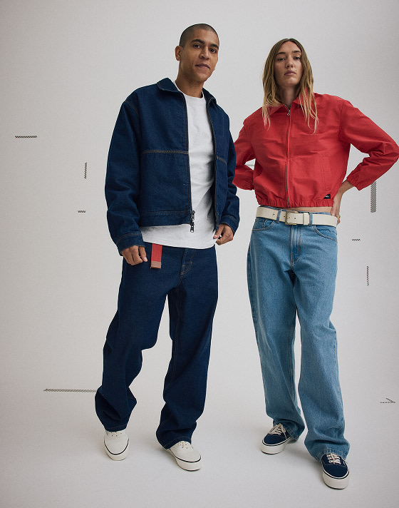 Right a woman in a Racing Red Lightweight Bomber Jacket and a man in a Premium Denim Station Jacket.