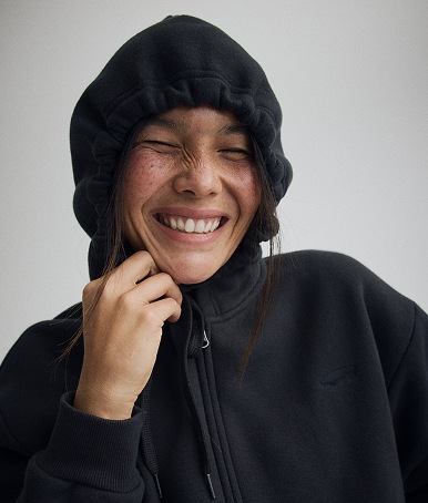 Close up of The Skate Loafer in Suede Black / Black on the floor of a grey photography studio.
