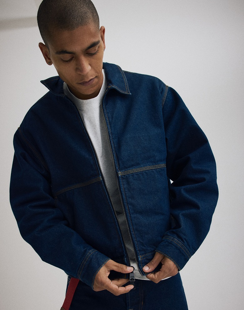 Medium shot of a man in a Premium Denim Station Jacket.