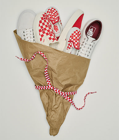 A variety of red and white Vans shoes wrapped in a bouquet from the Vans Valentine’s Day Collection.