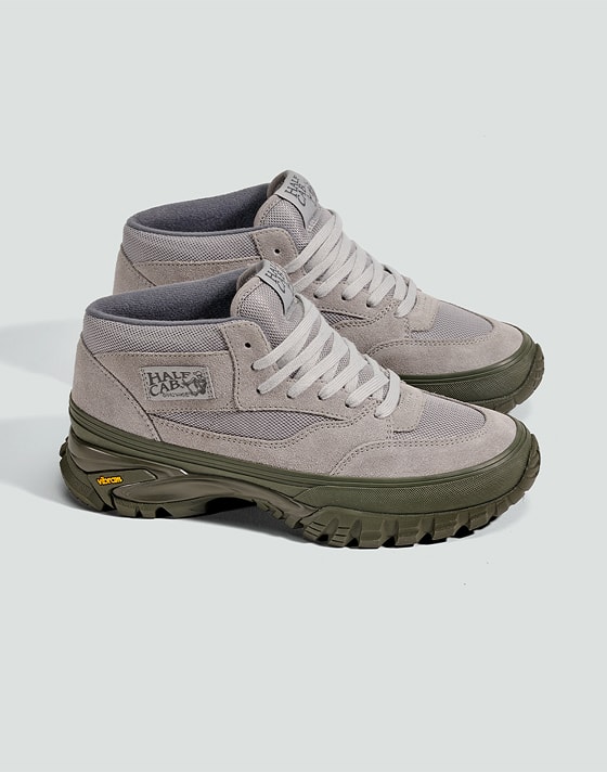 Medium shot of a pair of the the Premium Half Cab Vibram Shoe in Grey on the floor of a grey photography studio.