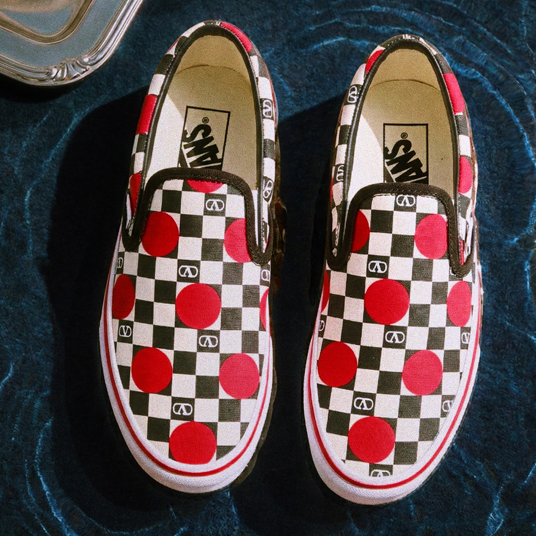 Pink Valentino and Vans Authentic on a flooded floor.