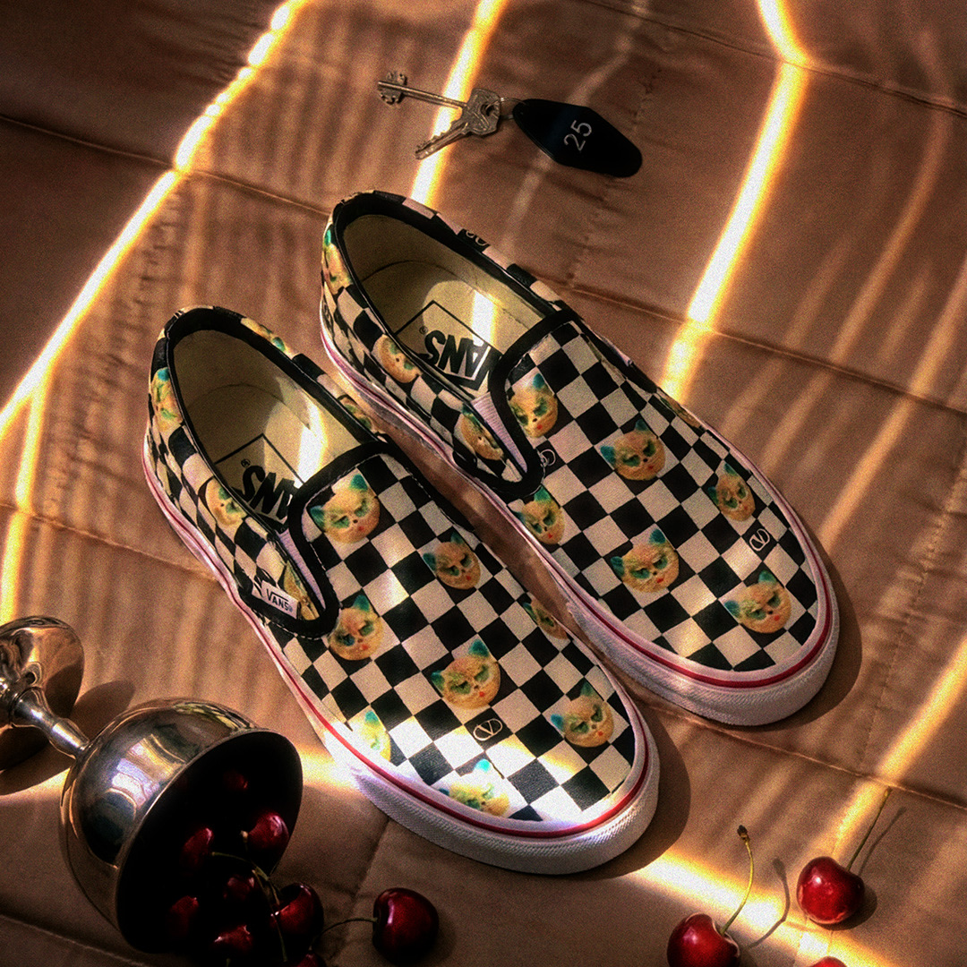 Pink Valentino and Vans Authentic on a flooded floor.