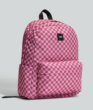 A mauvewood pink Old Skool Checkerboard Backpack in a photography studio.