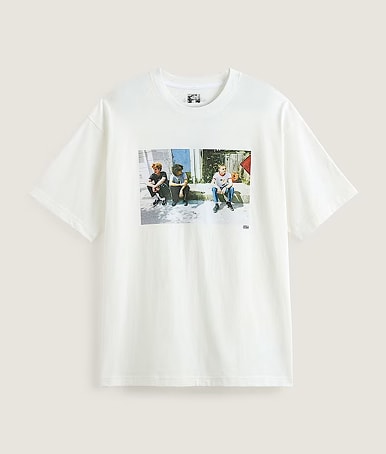 Medium shot of the Skate Curb T-Shirt by Atiba Jefferson in Atiba White with a plain tan color in the background.