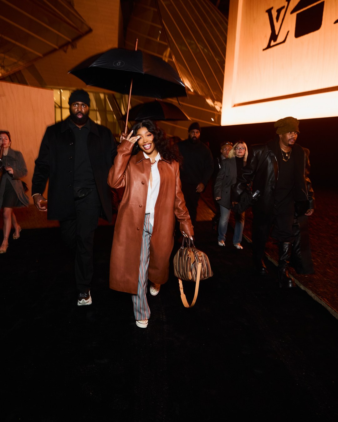 SZA walking into Paris Fashion Week. 