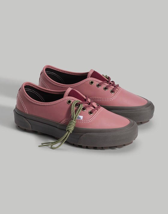 Medium shot of the Premium Authentic V-Lug Shoe in Dusty Rose Pink standing upright on the floor of a grey photography studio.