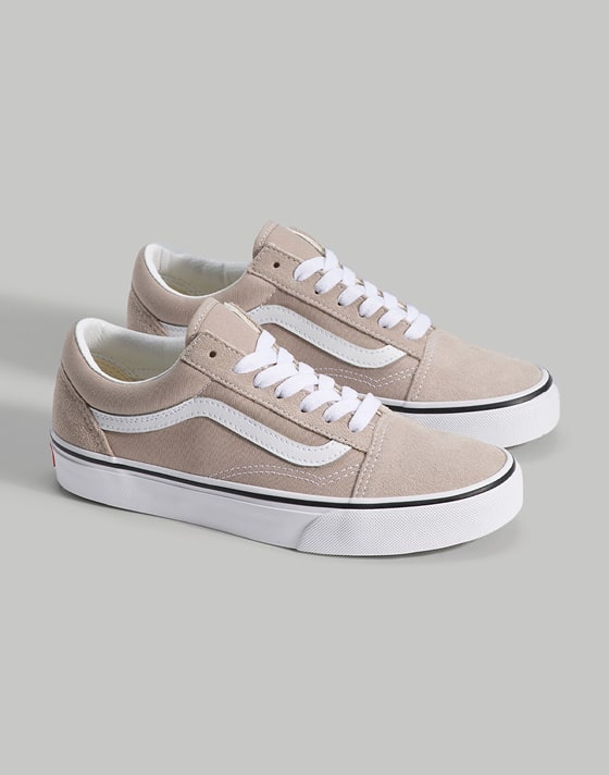 Medium shot of the Old Skool Shoe in Mushroom Brown standing upright on the floor of a grey photography studio.