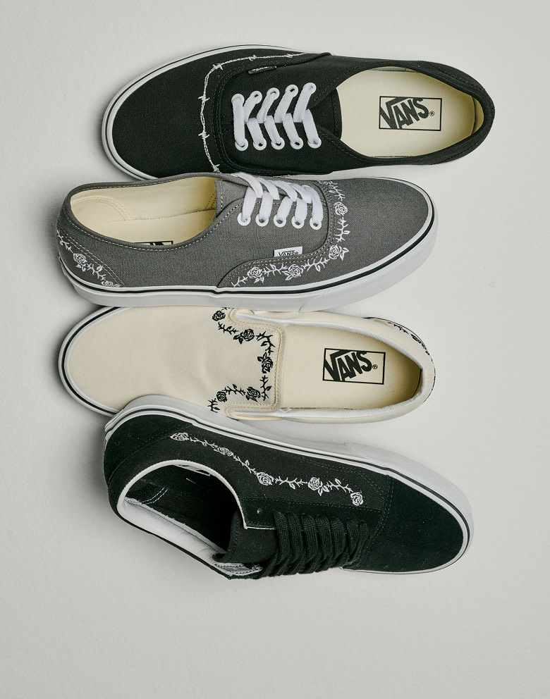 An Authentic, an Old Skool, and a Classic Slip-On from the embroidered collection lie on the floor of a photography studio.