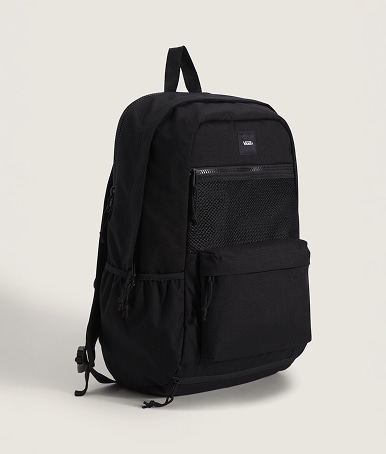 A black Divert Backpack on the floor of a photography studio.