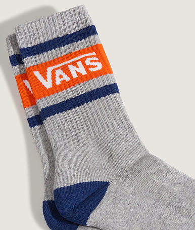 Close-up on a pair of deep indigo blue Vans Drop V Crew Socks.