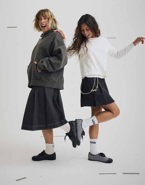 Two young women posing in a photography studio wearing the Premium Authentic Prima and other Vans new arrivals.