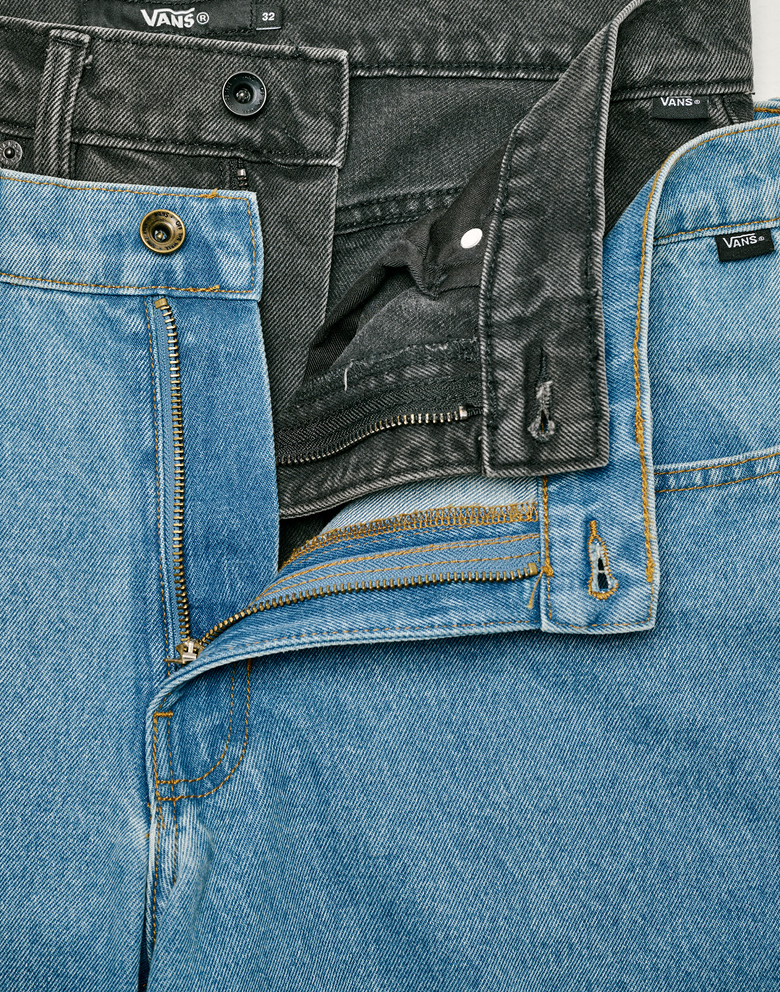 A pair of black and a pair of stonewash blue Check-5 Baggy Denim Pants stacked on top of each other.