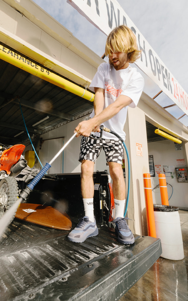 A young man washes out the bed of a truck at a car wash in the UltraRange Neo 2.0.