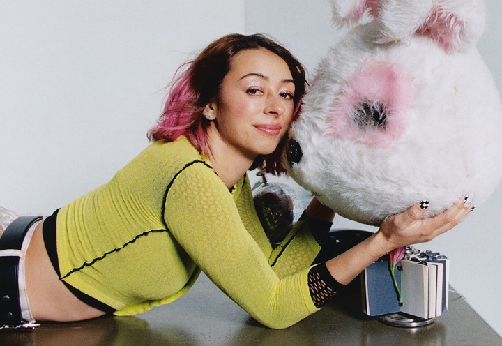 Vans Skate Team Rider and professional skateboarder Lizzie Armanto lying on a desk holding a giant costume bunny head.
