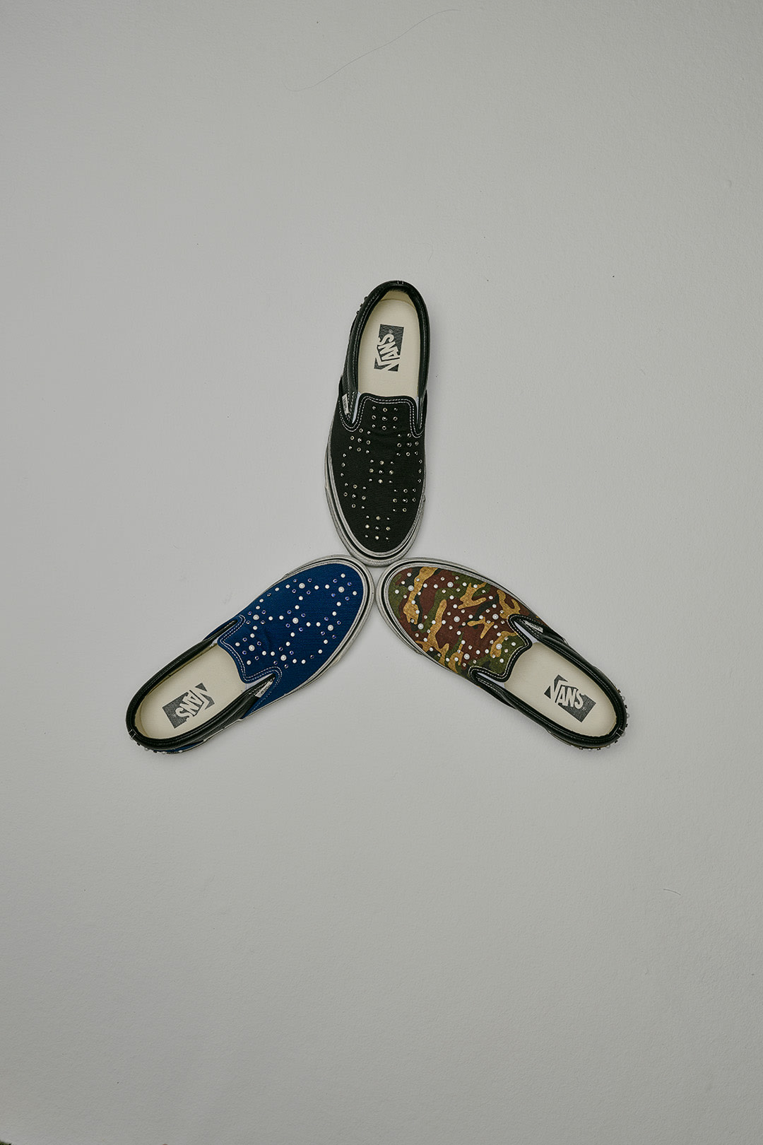 Three Classic Slip-On Pearlized Shoes, black, camo green and blue.