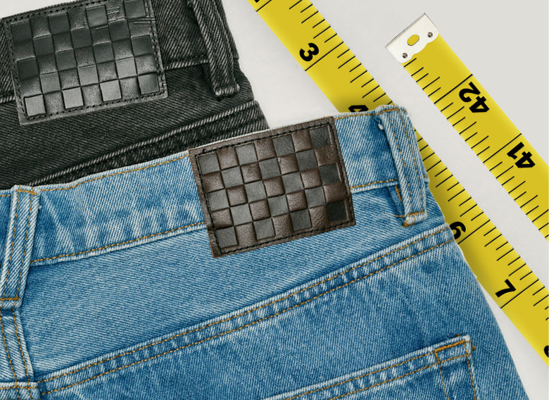 A pair of black and a pair of stonewash blue Check-5 Baggy Denim Pants stacked on top of each other.