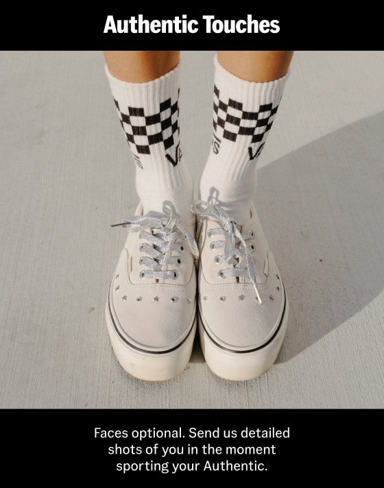 Close-up on a young woman wearing white Authentic Platform shoes and white and black Checkerboard Crew Socks.
