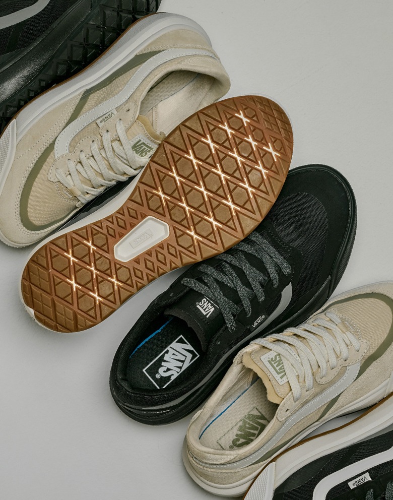 A variety of UltraRange 2.0 colorways lie on the ground next to each other on the floor of a photography studio.