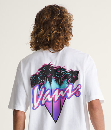 Close-up on the vibrant graphic on the back of a white Palm Drive T-Shirt in a photography studio.