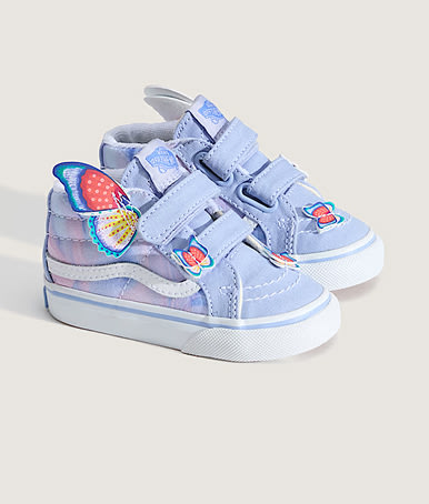 The side profile of purple and blue Toddler Sk8-Mid V Shoe with butterflies on the side in a photography studio.