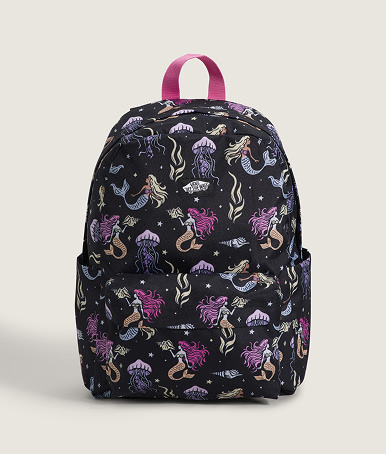 A mermaid and jellyfish print Old Skool Grom Backpack in a photography studio.
