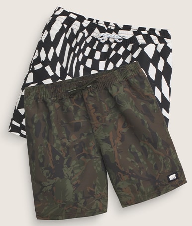 Black and white Primary II Printed Elastic Boardshorts and obsidian fern green Primary II Printed Elastic Boardshorts stacked on top of each other.