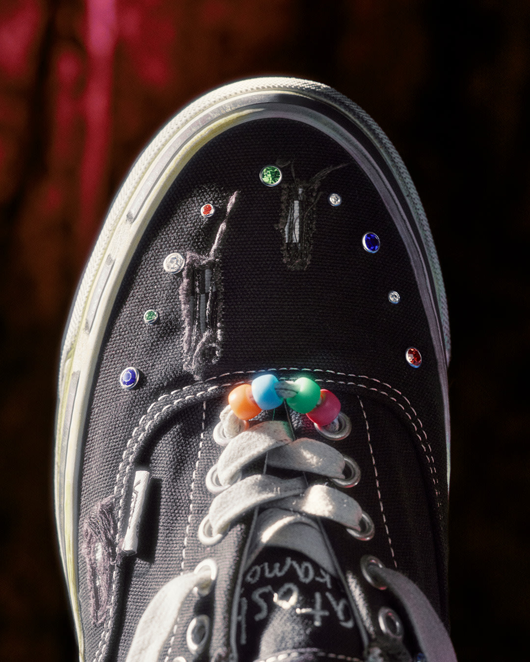 Gem and bead details on noes of the Vans x Satoshi shoe.