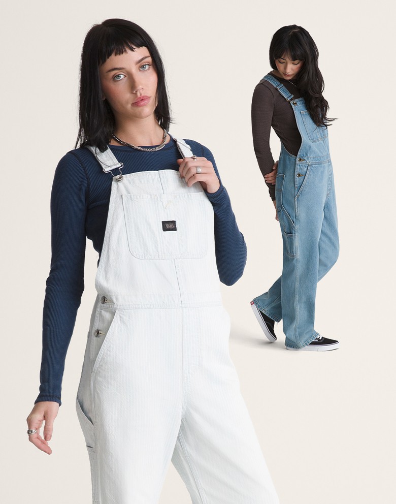 Two women in the stonewash blue colorway and the white colorway of Chore Denim Overall in a photography studio.