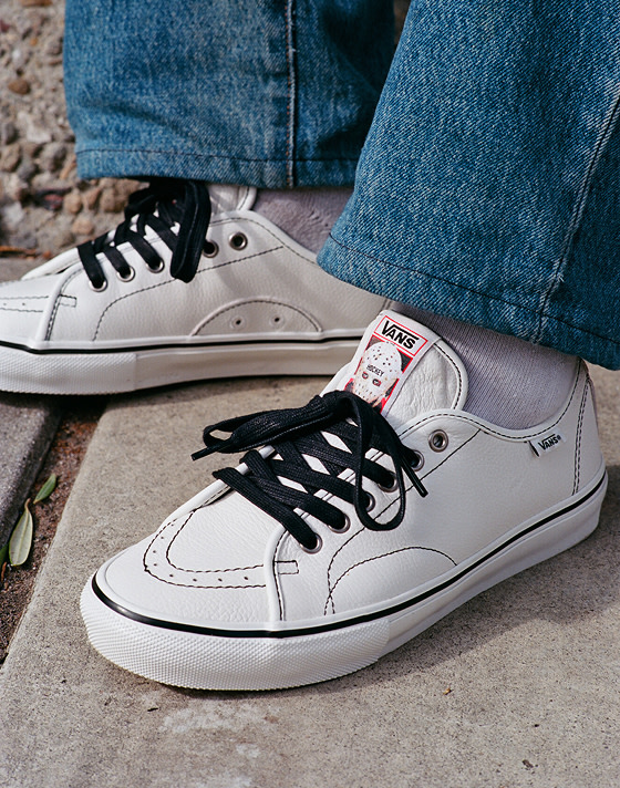 Close-up on the white AVE Classic by Hockey with black laces and hockey mask logo on the tongue.