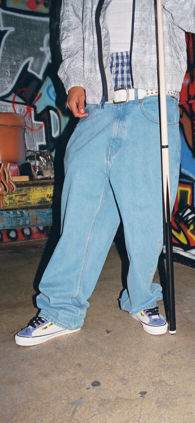 Waist down image of a person wearing the OTW x Old Skool 36 Knot shoes. 
