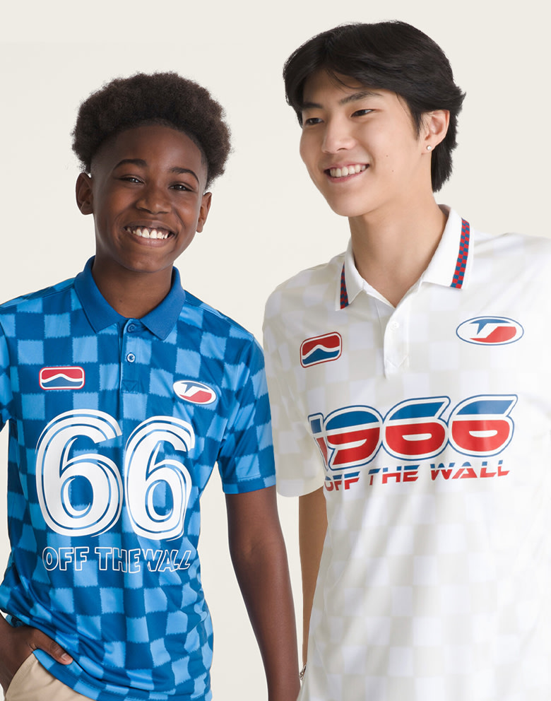 Two young men wearing a white Derby Soccer Jersey and a blue Hat Trick Soccer Jersey.