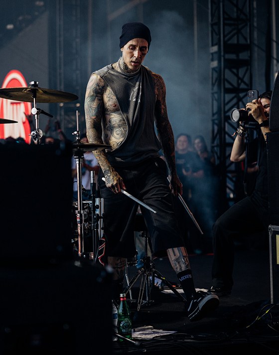 Drummer Travis Barker wearing black and white Old Skool on-stage at Vans Warped Tour.