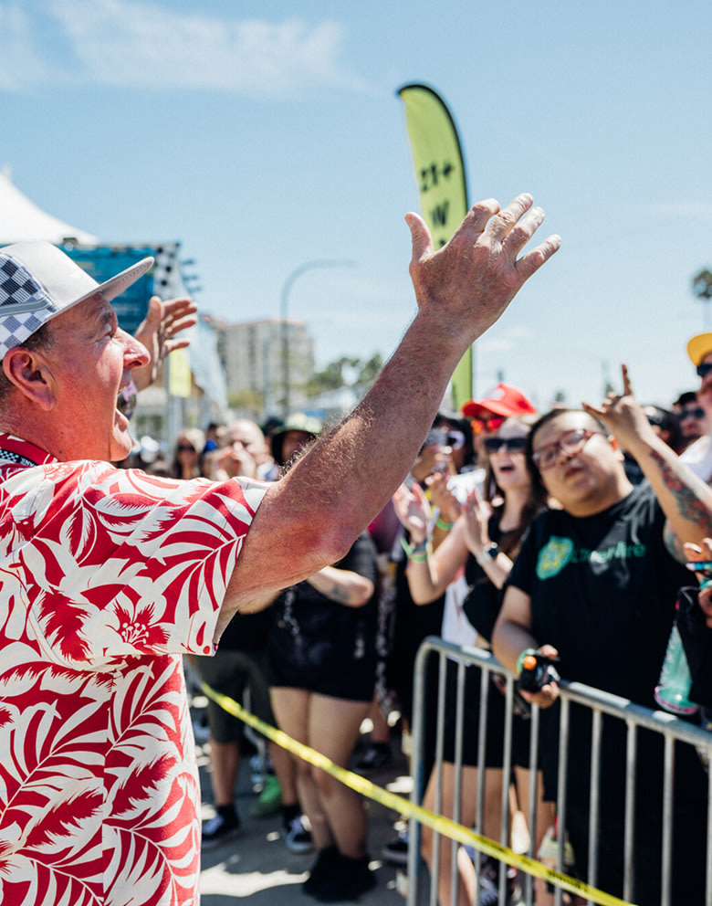 Vans founder Paul Van Doren greets the crowd on a sunny day at Vans Warped Tour.
