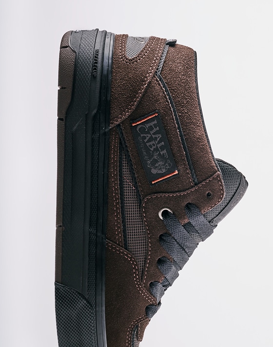 Medium shot of the Dick Rizzo Half Cab with WaffleCup standing vertically with a grey photography studio in the background.