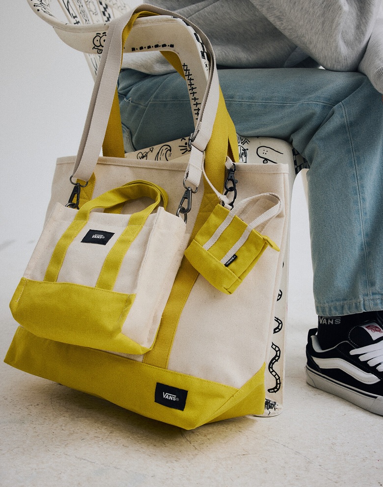 A dusty yellow Pergs Tote Bag, Lil Pergs Tote Bag, and Micro Pergs Tote Bag together in a photography studio.