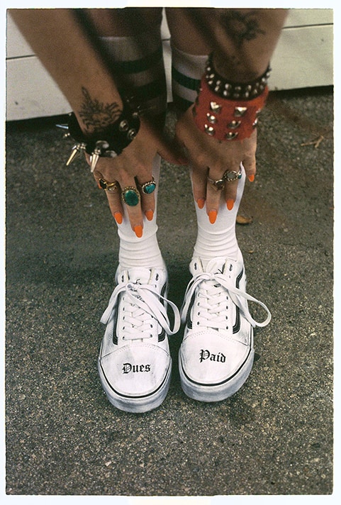 Close up image of someone wearing the Vans x Travis Barker Old skool shoes.