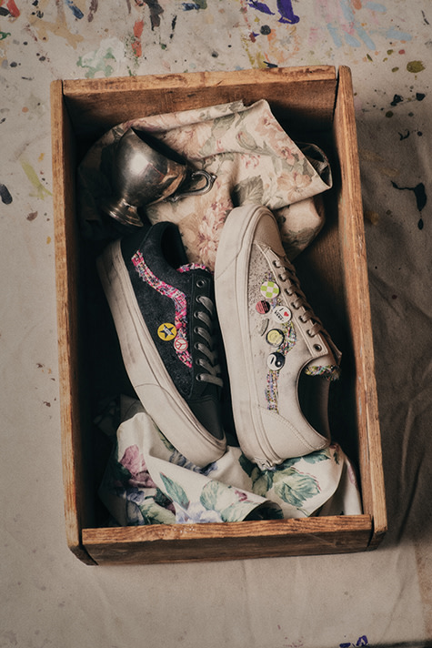 Photo of two different Vans Souvenir shoes in a wooden box.