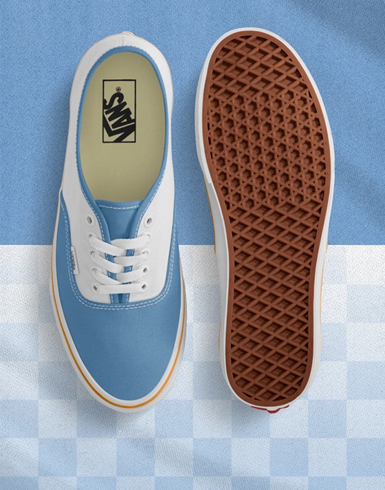Top down view of the light blue/white Authentic with one shoe sole up and both on a blue/white background but the bottom half is checkered white.