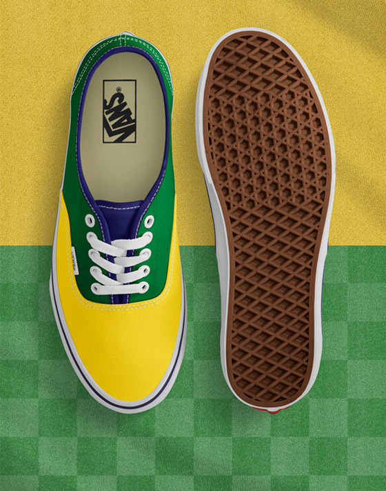 Top down view of the yellow/green Authentic with one shoe sole up and both on a split yellow/green background but the bottom half is checkered green.