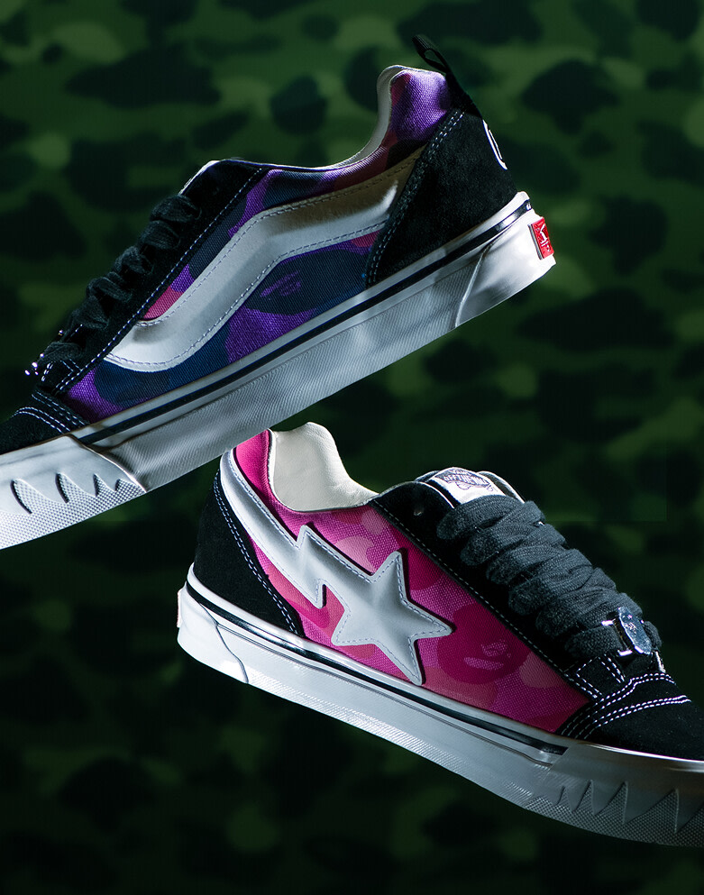 Image of the Vans X Bape Knu Skool shoes in pink and purple floating with a camo background. 
