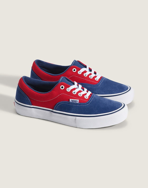 A pair of red and blue Era on the floor of a photography studio.
