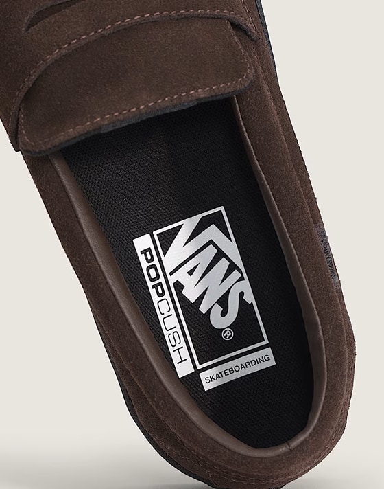 Close-up on the Vans logo on the inner sole of a brown Skate Loafer.