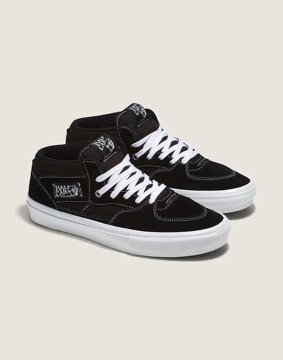 A pair of black Half Cab on the floor of a photography studio.
