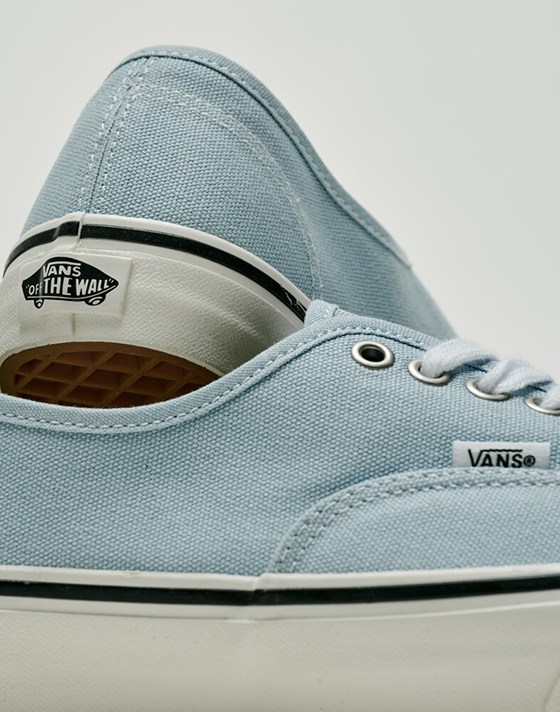 Close-up on a pair of light blue Authentic shoes in a photography studio.
